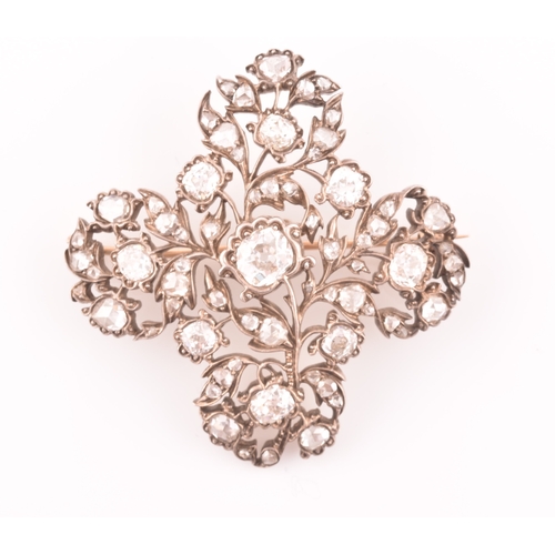 88 - A late Victorian diamond quatrefoil brooch, set with mixed old-cut diamonds, the openwork mount with... 