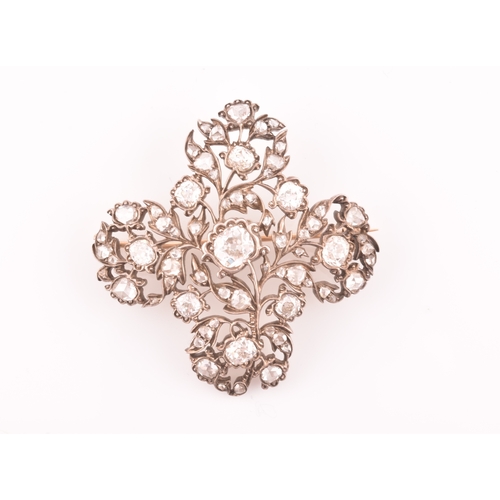 88 - A late Victorian diamond quatrefoil brooch, set with mixed old-cut diamonds, the openwork mount with... 