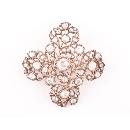 88 - A late Victorian diamond quatrefoil brooch, set with mixed old-cut diamonds, the openwork mount with... 