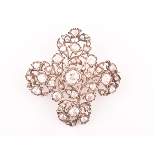 88 - A late Victorian diamond quatrefoil brooch, set with mixed old-cut diamonds, the openwork mount with... 