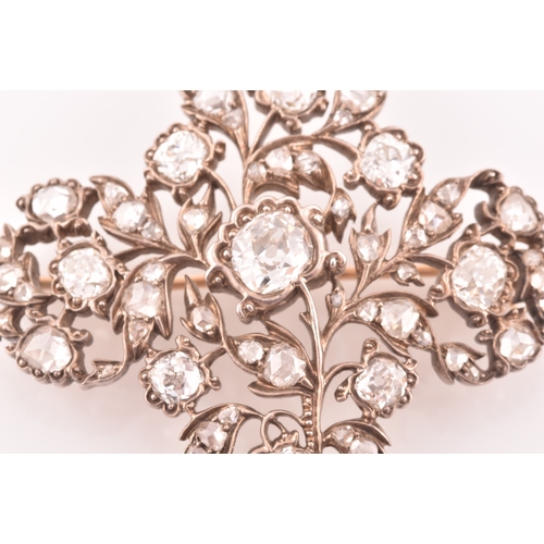 88 - A late Victorian diamond quatrefoil brooch, set with mixed old-cut diamonds, the openwork mount with... 