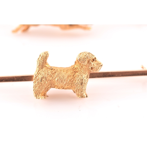 91 - A 15ct yellow gold bar brooch, mounted with a small terrier with textured fur, brooch 5.1 cm long, t... 