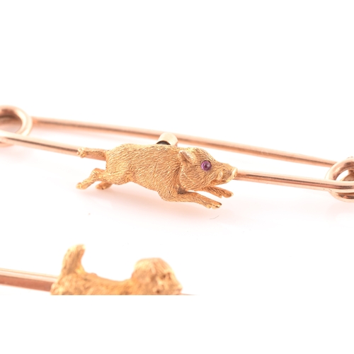 91 - A 15ct yellow gold bar brooch, mounted with a small terrier with textured fur, brooch 5.1 cm long, t... 