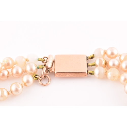 95 - A faux pearl necklace with 9ct yellow gold clasp, together with a pair of yellow metal and pearl cli... 