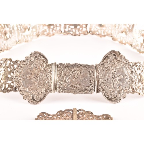 182 - A 19th century Continental white metal belt, with pierced and repose decoration depicting scenes of ... 