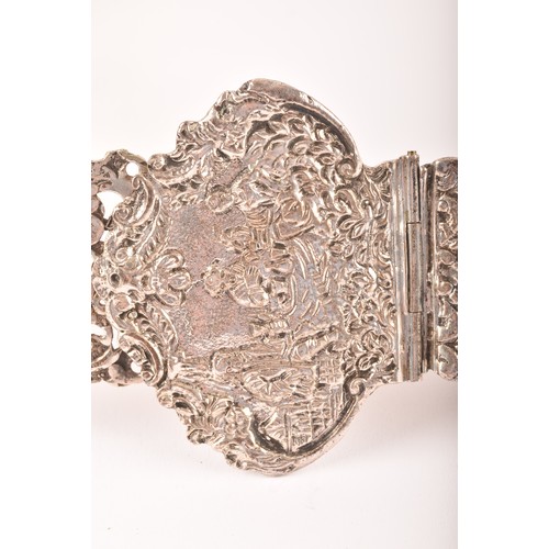 182 - A 19th century Continental white metal belt, with pierced and repose decoration depicting scenes of ... 