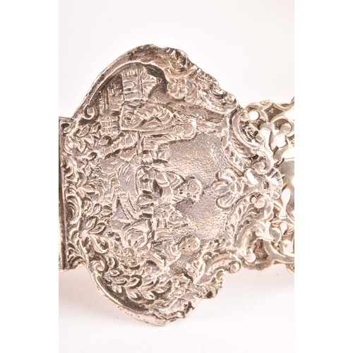 182 - A 19th century Continental white metal belt, with pierced and repose decoration depicting scenes of ... 