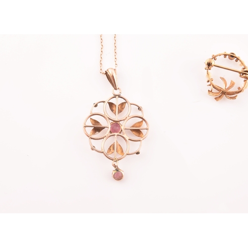 98 - A 9ct yellow gold Art Nouveau pendant, the openwork quatrefoil mount set with two pink tourmalines, ... 