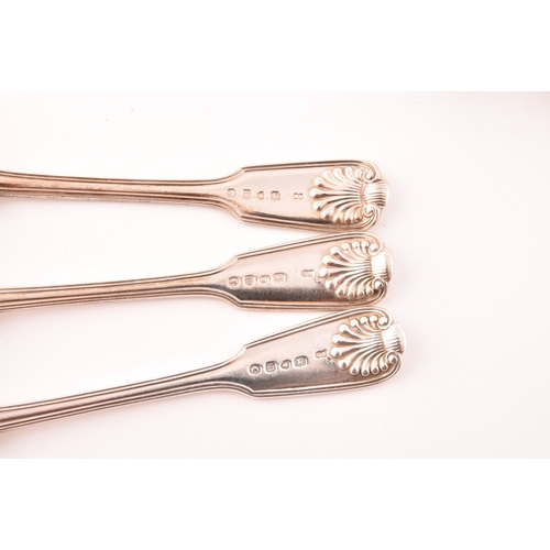 189 - A group of six silver serving spoons comprising: a set of three shell pattern fiddle and thread spoo... 