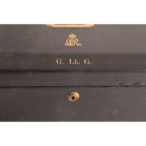 298 - A George V black leather despatch box the lid embossed in gilt letters 'G. LL. G', beneath an GRV ro... 