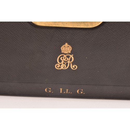 298 - A George V black leather despatch box the lid embossed in gilt letters 'G. LL. G', beneath an GRV ro... 