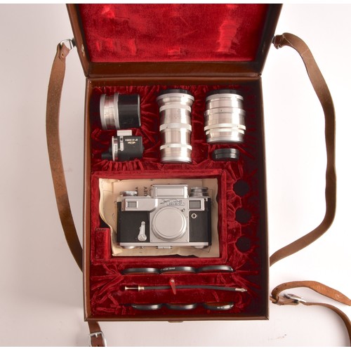 304 - A boxed Kiev 35mm camera and lens set of political interest, in a fitted box together with several l... 