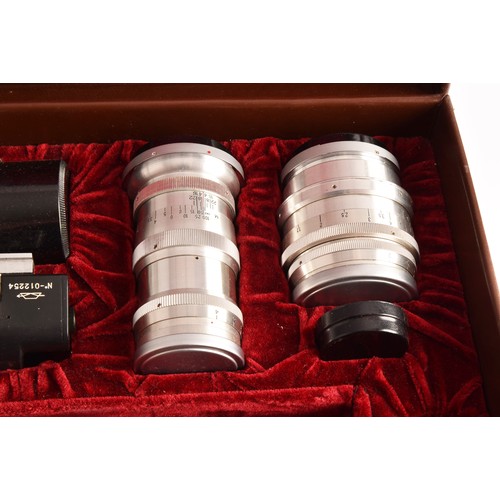 304 - A boxed Kiev 35mm camera and lens set of political interest, in a fitted box together with several l... 