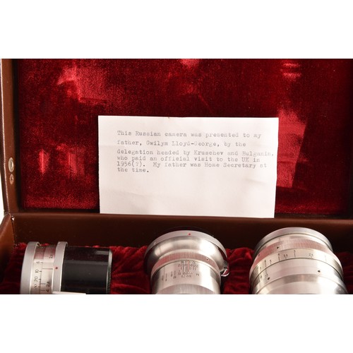 304 - A boxed Kiev 35mm camera and lens set of political interest, in a fitted box together with several l... 