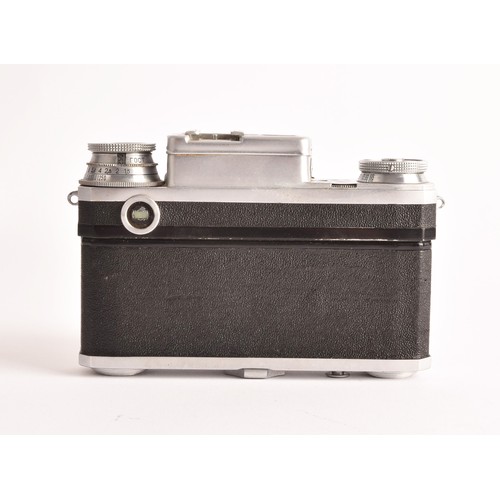 304 - A boxed Kiev 35mm camera and lens set of political interest, in a fitted box together with several l... 