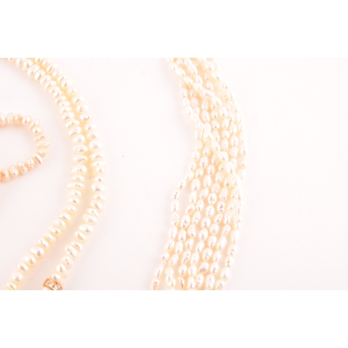 102 - A six strand necklace of 'rice crispie' pearls, fastened with a gilt metal clasp, together with a do... 