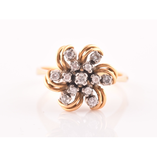 106 - A yellow gold and diamond floral starburst cluster ring, set with thirteen round-cut diamonds, with ... 