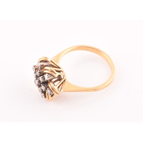 106 - A yellow gold and diamond floral starburst cluster ring, set with thirteen round-cut diamonds, with ... 