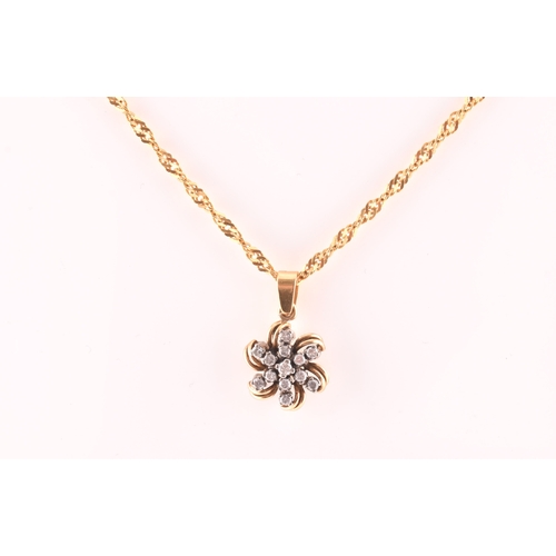 107 - A yellow metal and diamond floral diamond starburst pendant, set with thirteen round brilliant-cut d... 