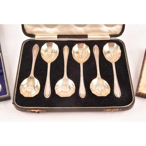 192 - A pair of Victorian silver serving spoons with later embossed floral decoration, together with a set... 