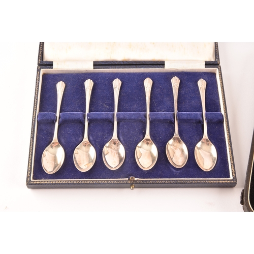 192 - A pair of Victorian silver serving spoons with later embossed floral decoration, together with a set... 