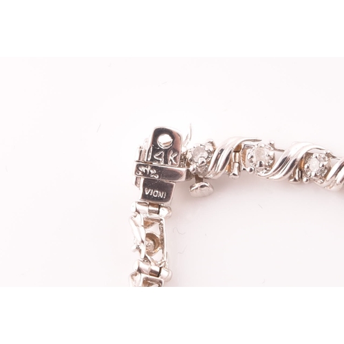 111 - A 14ct white gold and diamond line bracelet, the articulated links set with round brilliant-cut diam... 