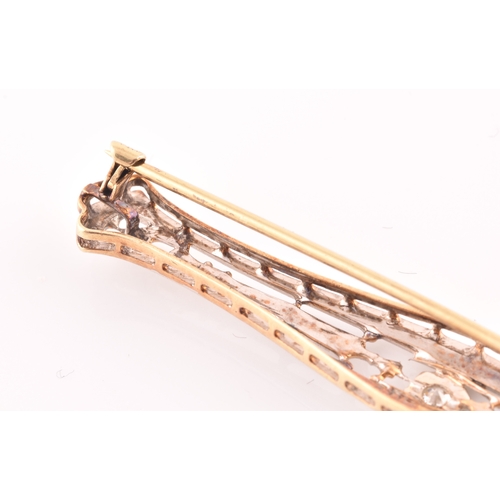 112 - A white and yellow metal bar brooch, in the Art Deco style, inset with a round brilliant-cut diamond... 