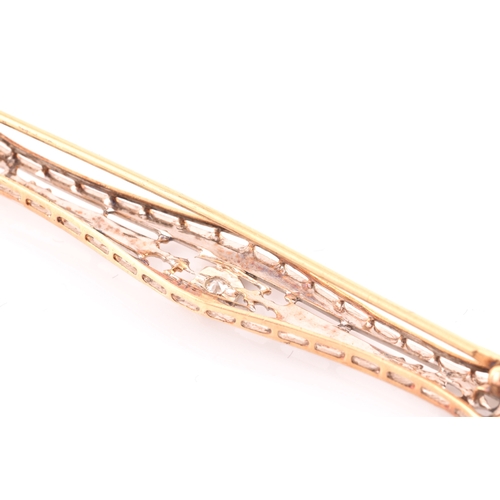 112 - A white and yellow metal bar brooch, in the Art Deco style, inset with a round brilliant-cut diamond... 