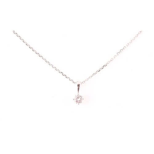 117 - A 9ct white gold mounted solitaire diamond pendant, of approximately 0.30 carats, suspended on a 9ct... 