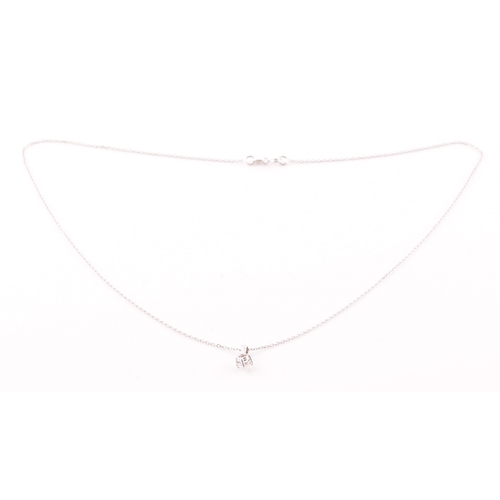 117 - A 9ct white gold mounted solitaire diamond pendant, of approximately 0.30 carats, suspended on a 9ct... 