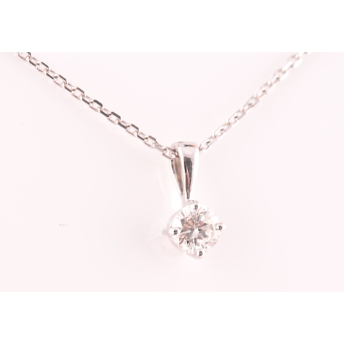 117 - A 9ct white gold mounted solitaire diamond pendant, of approximately 0.30 carats, suspended on a 9ct... 