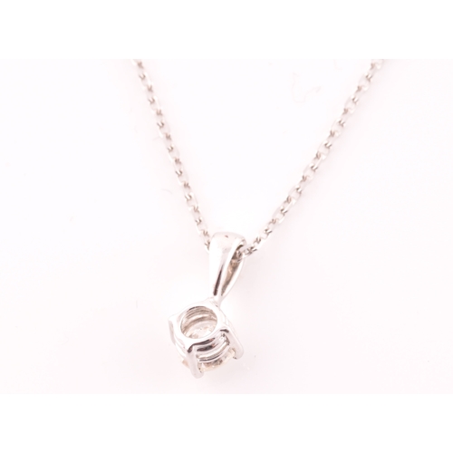 117 - A 9ct white gold mounted solitaire diamond pendant, of approximately 0.30 carats, suspended on a 9ct... 