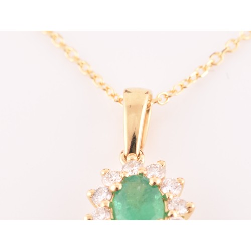 118 - An 18ct yellow gold, diamond, and emerald cluster pendant, set with a mixed oval-cut emerald, within... 