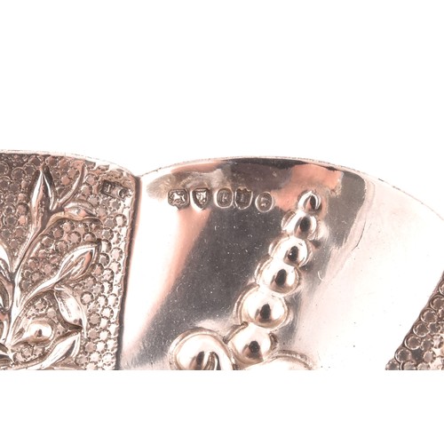 194 - A collection of four pieces of novelty and religious silver, including: a Victorian repose silver lo... 