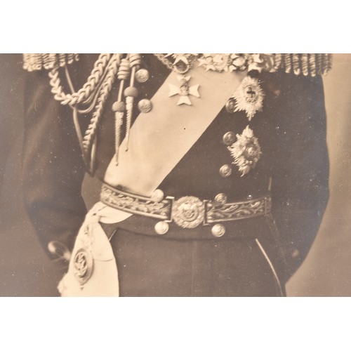 293 - King George V and Queen Mary, a pair of signed photographs of the King and Queen, each signed in ink... 