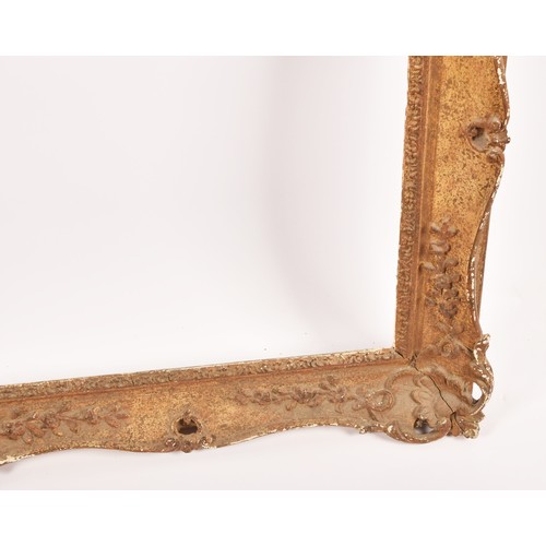 274 - A large gilt gesso picture frame, decorated with scrolls and harebells. Overall size 148 x 124 cm, t... 