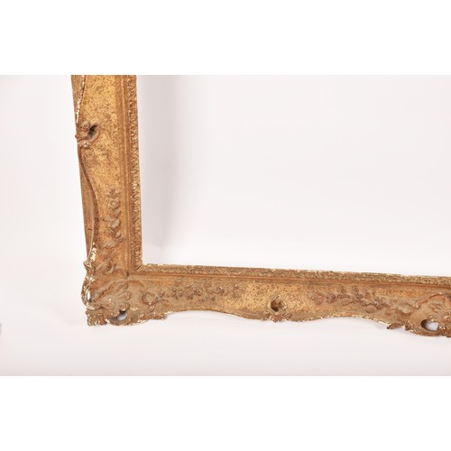 274 - A large gilt gesso picture frame, decorated with scrolls and harebells. Overall size 148 x 124 cm, t... 