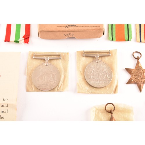 312 - A group of six WWII Medals comprising: a 1939-45 War Medal; a Defence Medal; a 1939-45 Star; an Afri... 