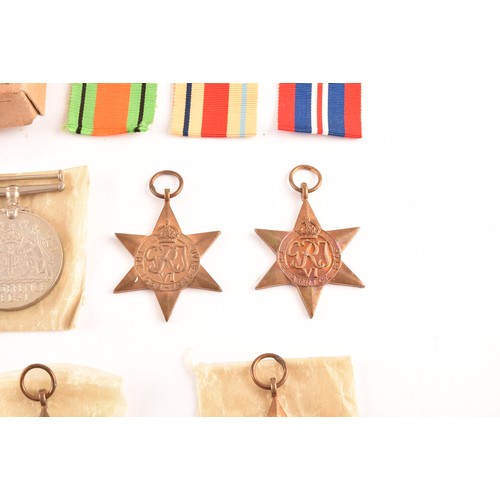 312 - A group of six WWII Medals comprising: a 1939-45 War Medal; a Defence Medal; a 1939-45 Star; an Afri... 