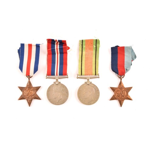 313 - A group of four WWII Medals comprising: a 1939-45 War Medal; a Defence Medal; a 1939-1945 Star and a... 