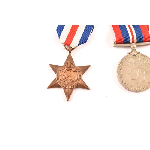 313 - A group of four WWII Medals comprising: a 1939-45 War Medal; a Defence Medal; a 1939-1945 Star and a... 