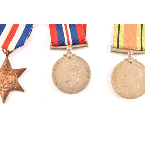 313 - A group of four WWII Medals comprising: a 1939-45 War Medal; a Defence Medal; a 1939-1945 Star and a... 