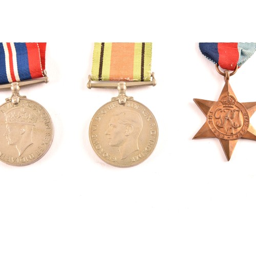 313 - A group of four WWII Medals comprising: a 1939-45 War Medal; a Defence Medal; a 1939-1945 Star and a... 