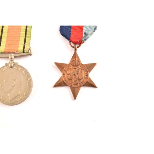 313 - A group of four WWII Medals comprising: a 1939-45 War Medal; a Defence Medal; a 1939-1945 Star and a... 