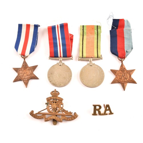 313 - A group of four WWII Medals comprising: a 1939-45 War Medal; a Defence Medal; a 1939-1945 Star and a... 