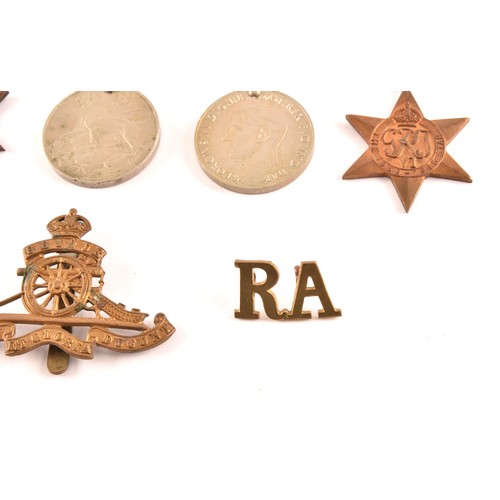 313 - A group of four WWII Medals comprising: a 1939-45 War Medal; a Defence Medal; a 1939-1945 Star and a... 