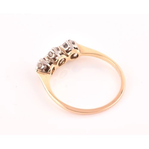 61 - A yellow metal and diamond ring, set with three transitional-cut diamonds of approximately 0.60 cara... 