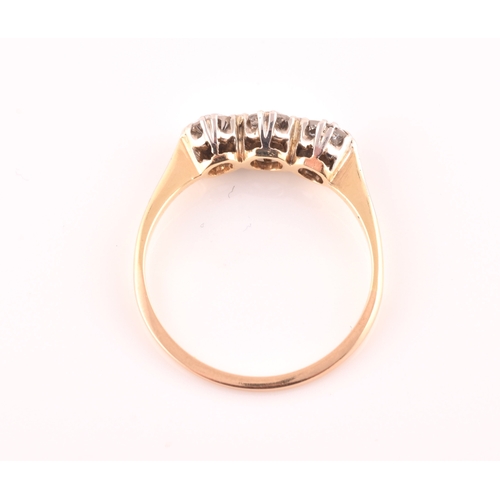 61 - A yellow metal and diamond ring, set with three transitional-cut diamonds of approximately 0.60 cara... 