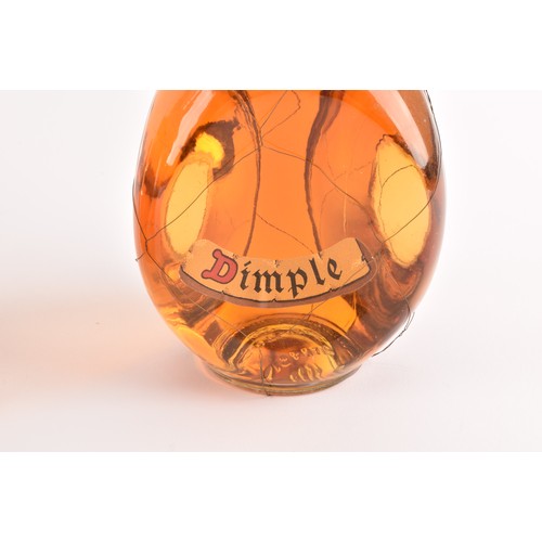 319 - A bottle of deluxe John Haig & Co Dimple old blended Scotch whisky, the bottle with decorative p... 