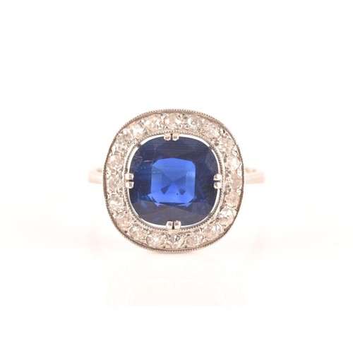 35 - An early 20th century natural and unenhanced sapphire, diamond and platinum ring, set with a cushion... 